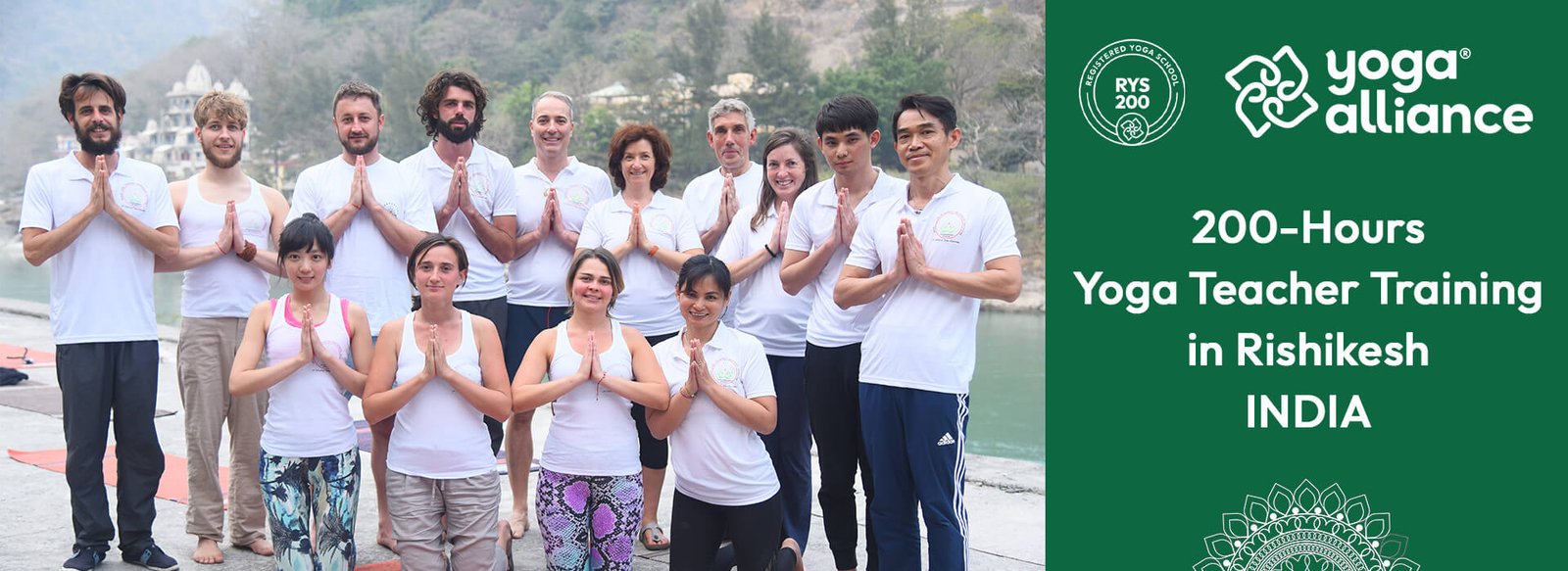 Group of international students practicing namaste pose during a 200-hour yoga teacher training in Rishikesh, India, certified by Yoga Alliance.