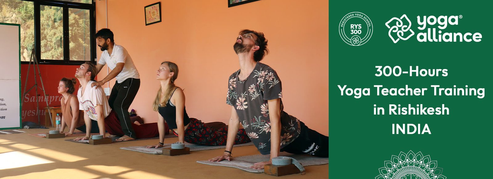 Students practicing a backbend yoga posture during 300-hour Yoga Alliance teacher training in Rishikesh, India.